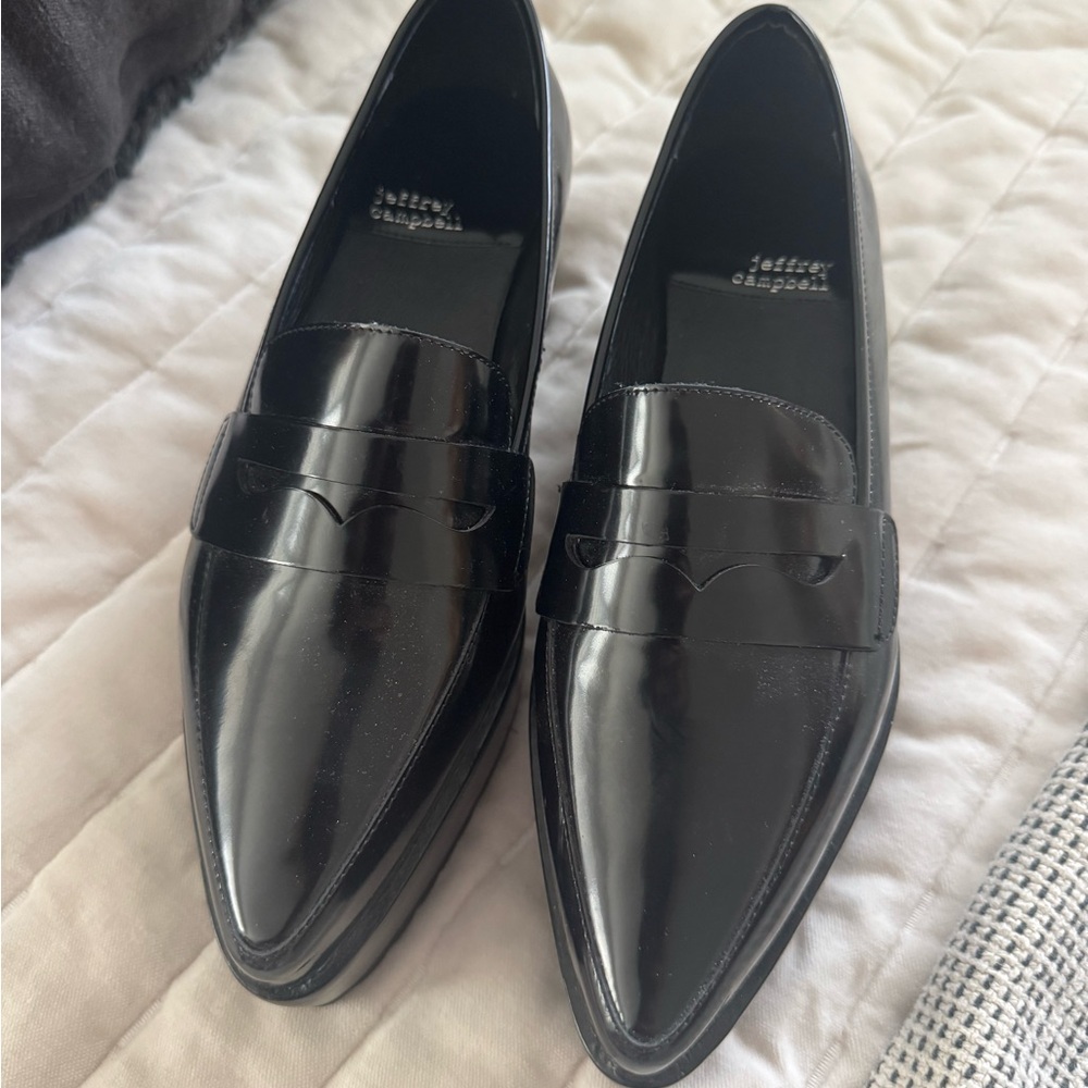 Women’s Jeffrey Campbell black patent leather platform loafers.